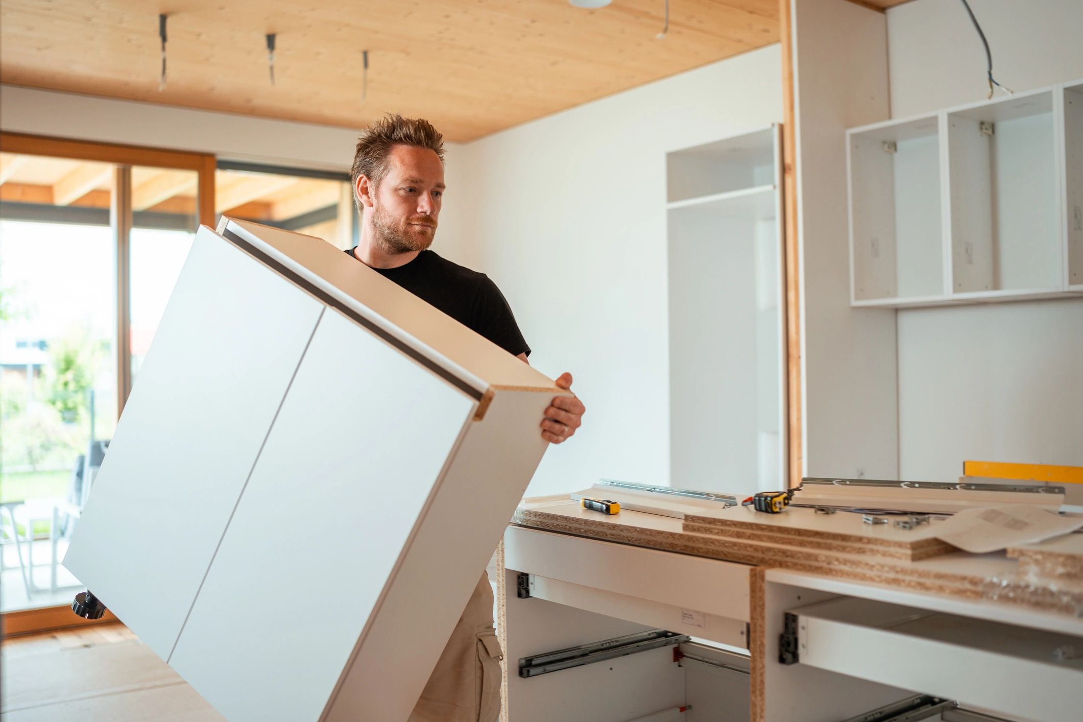 Cabinets being installed.