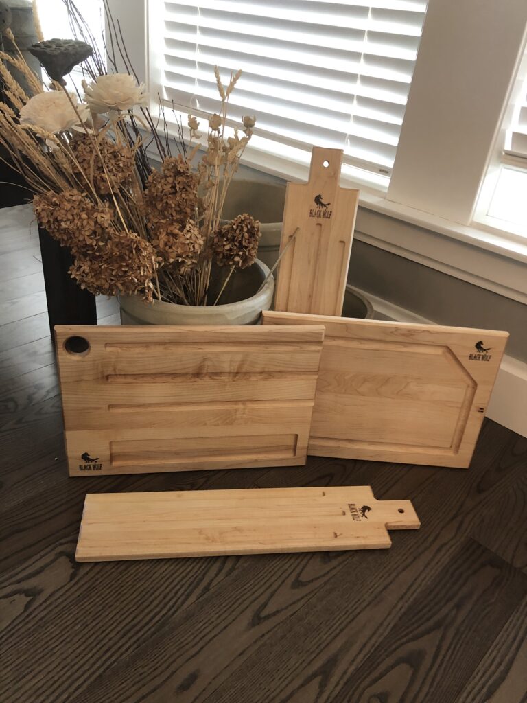 Assortment of charcuterie boards and serving boards.