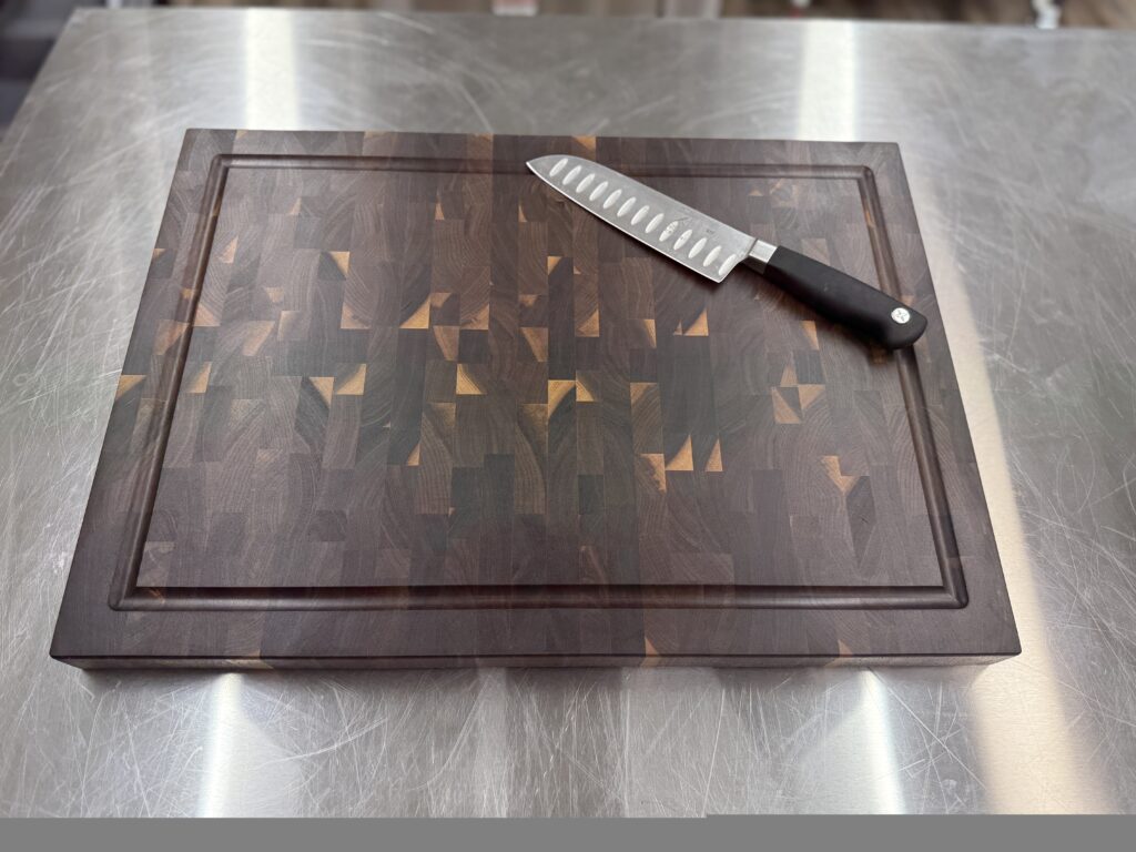 Walnut end grain cutting board on kitchen counter for daily food prep