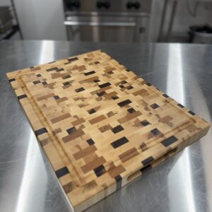 Mixed‑species maple, cherry, and walnut end grain cutting board, 22"×16"×1-1/2" handcrafted in Saskatchewan by Black Wolf Industries.