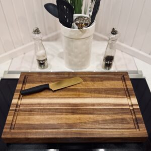 Walnut edge‑grain cutting board, 16x22x1.5 inches, handcrafted hardwood.